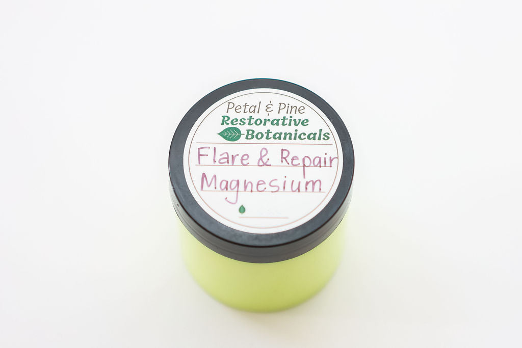 Green container with black lid labeled 'Flare & Repair Magnesium' on a white background