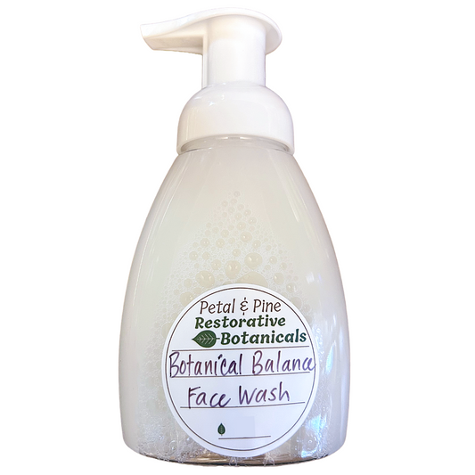 Foam face wash bottle with pump and 'Petal & Pine' label on a white background