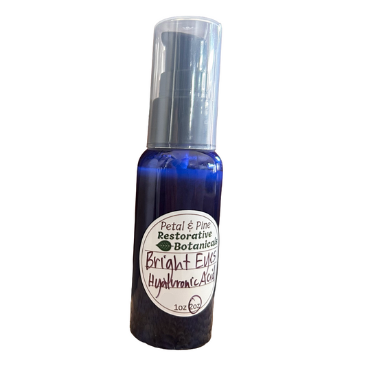 Bottle of Petal & Pine Restorative Botanicals Bright Eyes Hyaluronic Acid on a white background