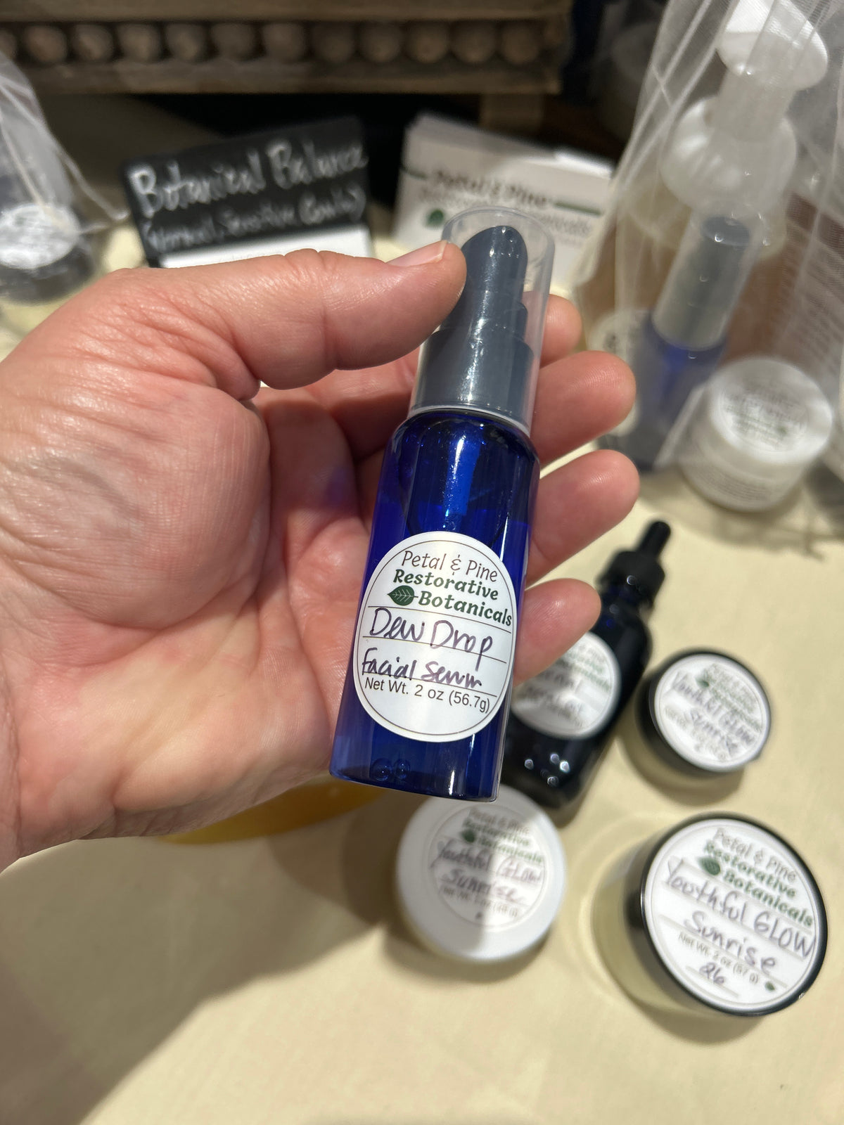 Hand holding Hyaluronic Acid Facial Serum