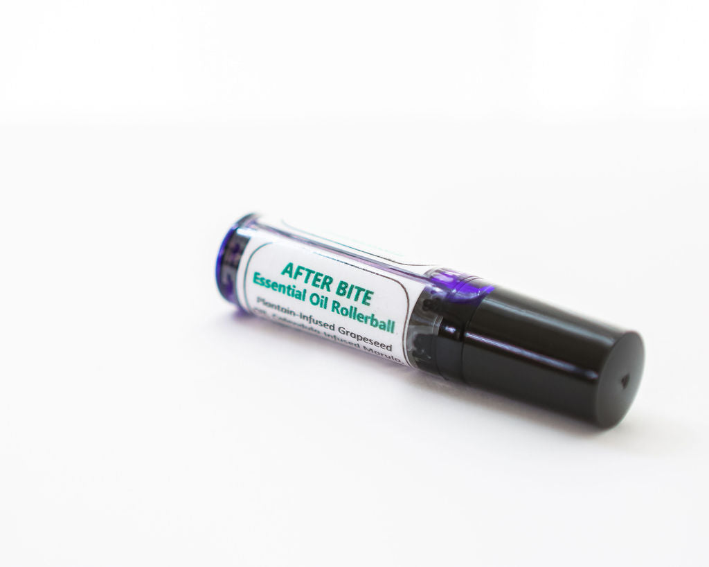 Rollerball bottle labeled 'After Bite Herbal & Essential Oil' on a white background