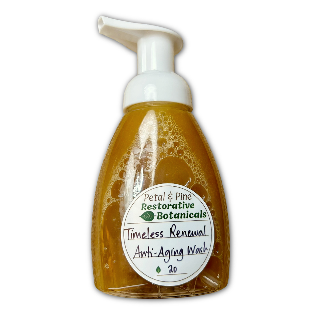 Foam soap bottle with 'Petal & Pine Restorative Botanicals' label for the Timeless Renewal Anti-Aging Face Wash on a white background