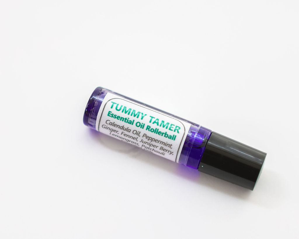 Tummy Tamer essential oil rollerball on a white background