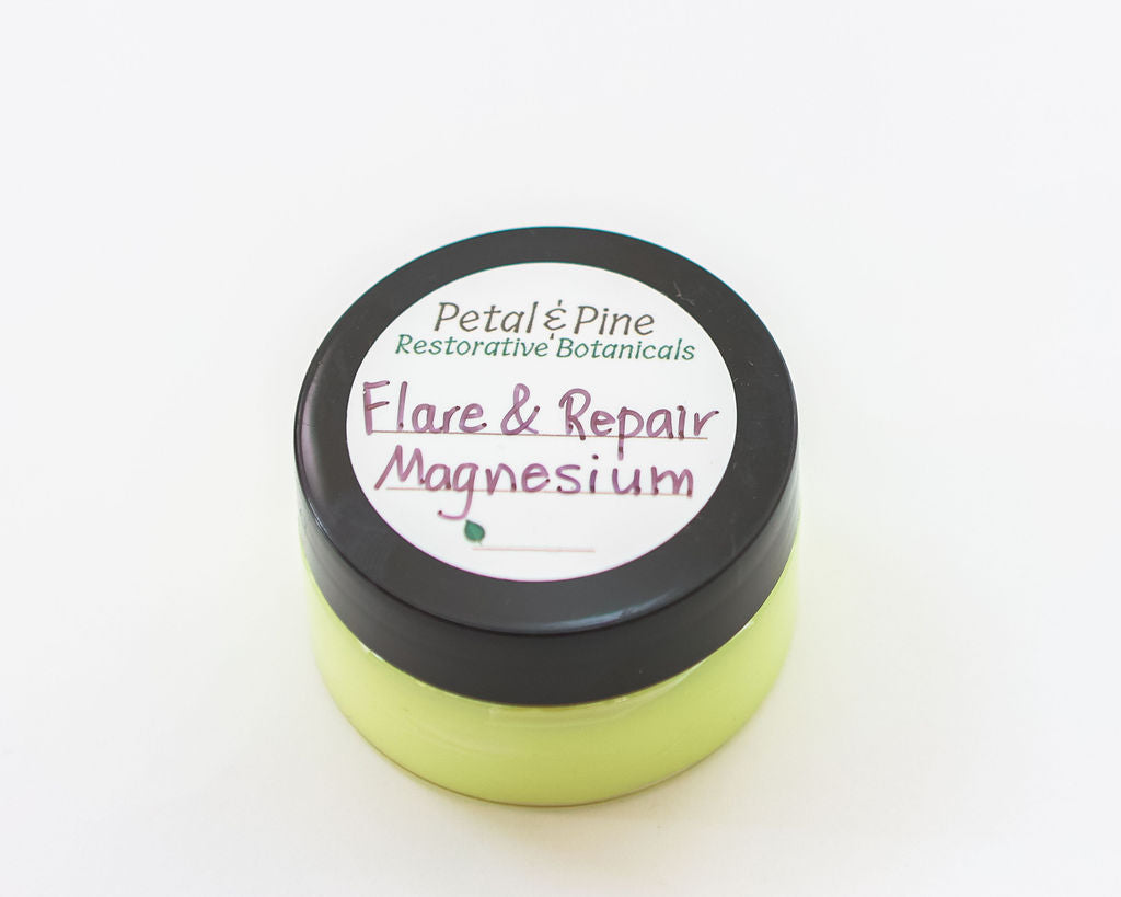 Green jar labeled 'Flare & Repair Magnesium' by Petal & Pine on a white background