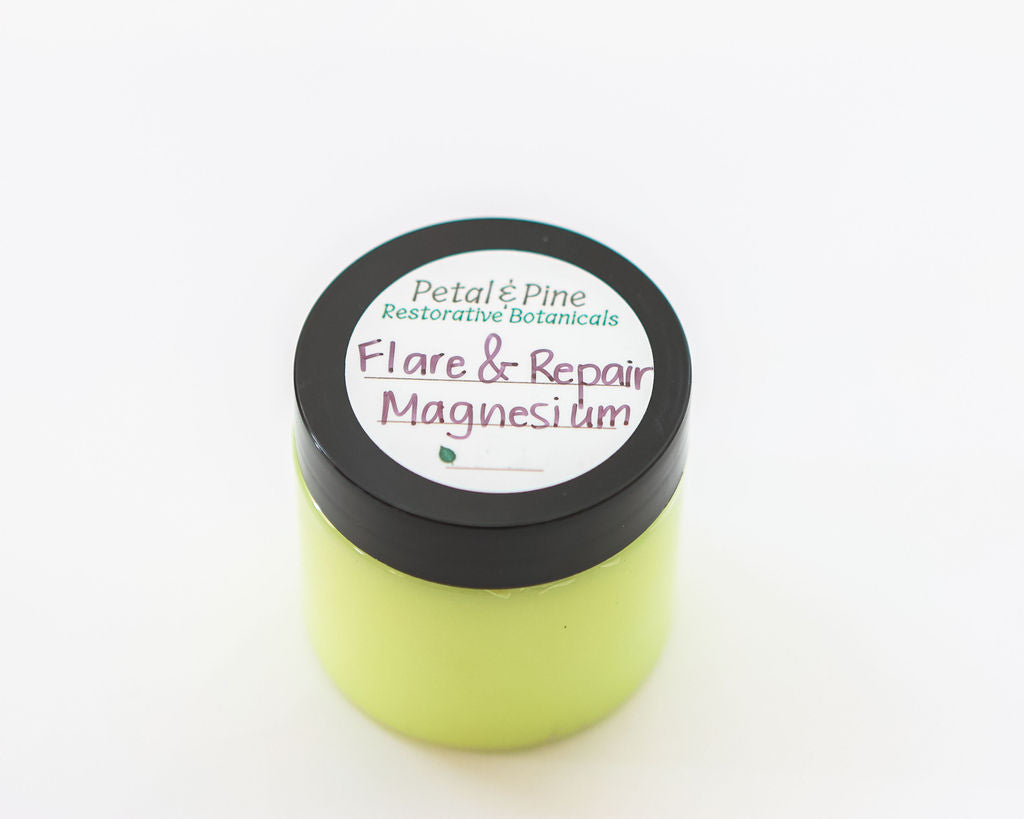 Green jar labeled 'Flare & Repair Magnesium' by Petal & Pine on a white background