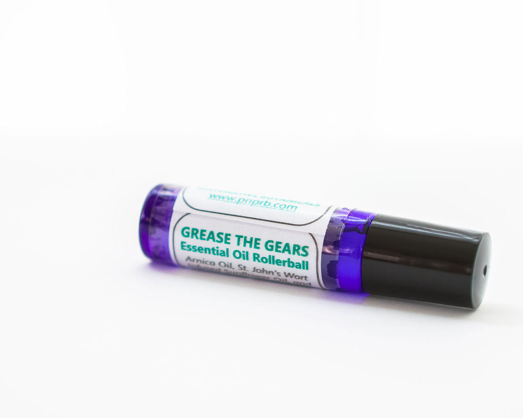 Essential oil rollerball labeled 'Grease the Gears' on a white background