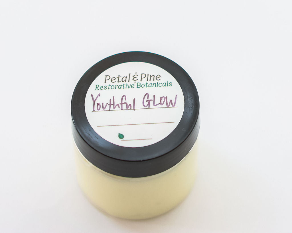 Jar of 'Youthful Glow' product by Petal & Pine on a white background
